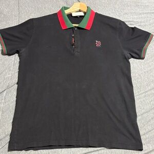 Black Polo Shirt with Red and Green Accents